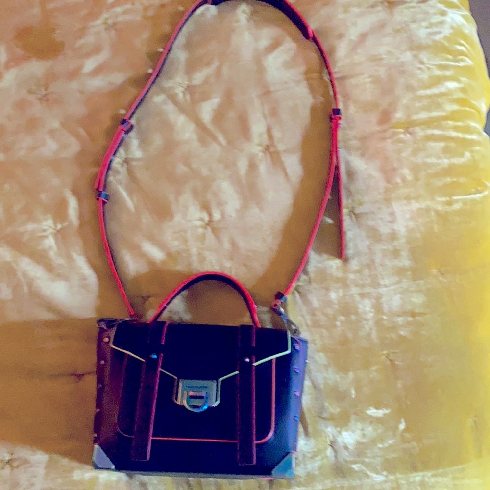 Michael Kors Mothschool purse. Used 3 times. Note: thin scratch on the back.